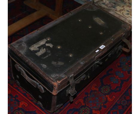 A vintage leather and metal bound travel trunk retailed by J. C. Anderson 21 Blake Street York.