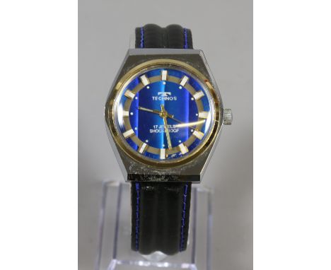 A gentleman's manual wristwatch with blue dial silver/gold baton marker second sweep finger and black leather strap.