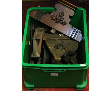 A box of wall clock pediments, finials and other carvings.