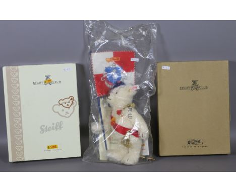 Two boxed Steiff club miniature teddy bears one in blue 2004 and the other in silver grey 2009 and a large packaged 'Robarer'