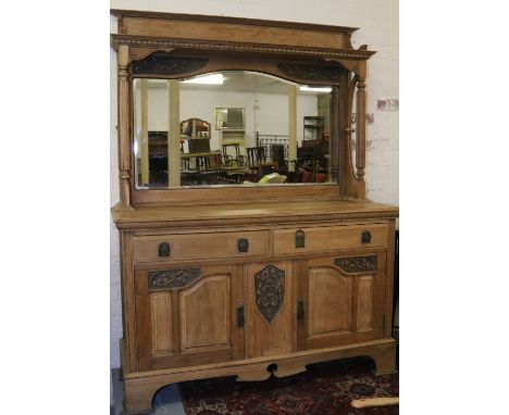 A Victorian light oak carved mirror back sideboard.