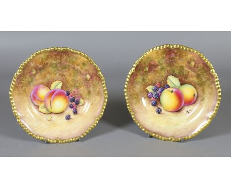 A pair of Royal Worcester side plates hand painted with fruit, signed J. Reed. Black printed marks, 15cm diameter. Condition 
