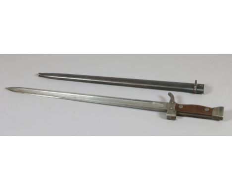 A bayonet in metal scabbard stamped 73417.