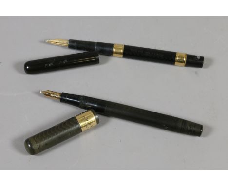 Two vintage Swan fountain pens with gold mounts and nibs.