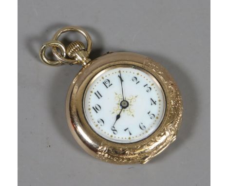 A ladies 12.5 carat gold fob watch with button wind and gilt enamel dial.