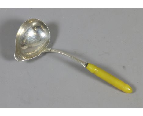 A Georg Jensen silver small toddy ladle with planished bowl. Punch marks. 