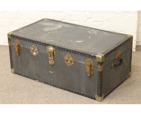 A canvas metal bound travel trunk.