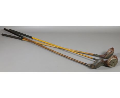 Three vintage golf drivers with hickory shafts. One stamped A Dailey, Bradley Hall Co. Halifax.