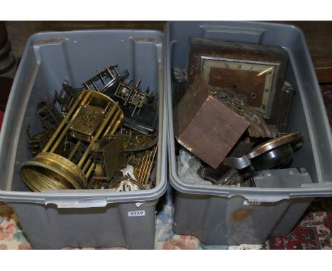 Two boxes of various clock parts for spares and repairs.