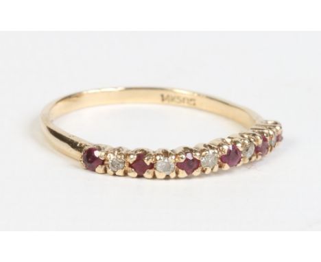 A 14ct gold, ruby and diamond line ring UK size N1/2.