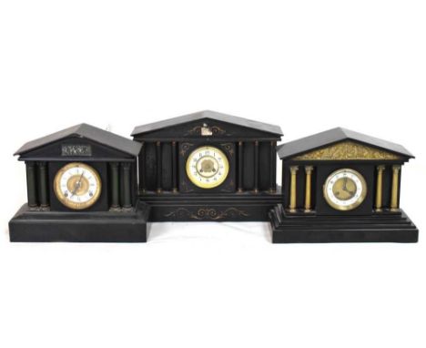 Two black slate temple clocks and one metal cased temple clock, the largest 51cm x 31cm high (3)