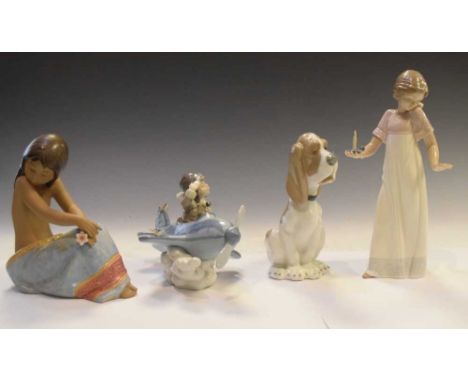 Lladro 5697 'Over The Clouds' figure and 2382 'Island Beauty', together with two Nao figures, with boxes, tallest 27cm high 