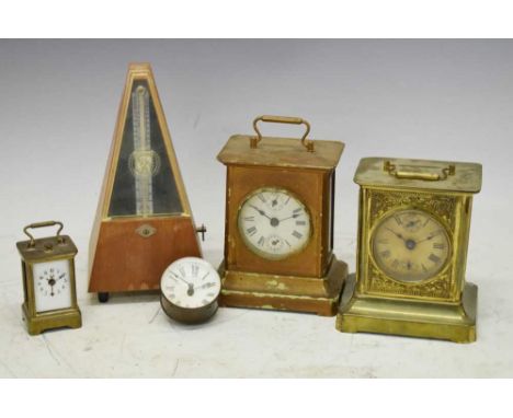 Two German gilt tin-plate carriage clocks, 15.5cm high, two other clocks, and a German metronome (5)