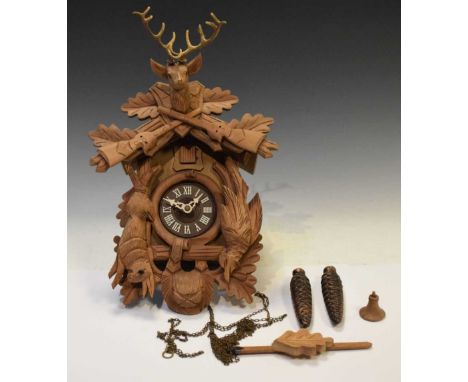 Late 20th Century cuckoo clock with carved decoration, 41cm high