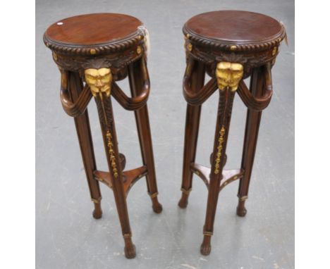 A pair of ornate George IV style urn stands 20th Century
Each with a 36cm top with a gadrooned border leaf and flower frieze 