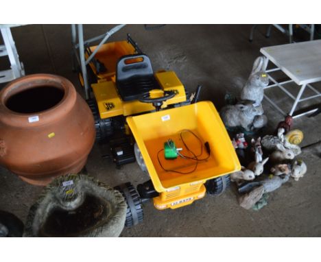 A child's toy JCB tractor with charger