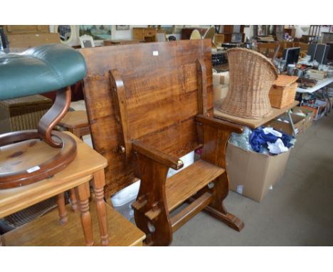 An Arts &amp; Crafts style oak monk bench