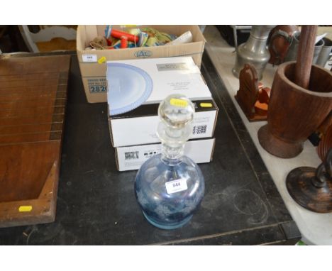 A decanter and stopper, together with Royal Worcester serving bowls in original boxes