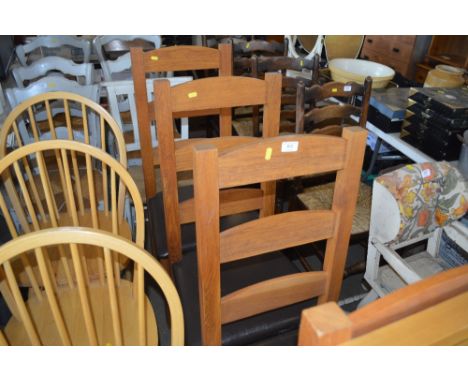 A set of four oak ladder back dining  chairs