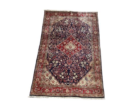 A vintage Persian style rug. 135x214cm (10)