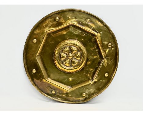 A Late 19th Century Arts &amp; Crafts brass wall charger. 42cm