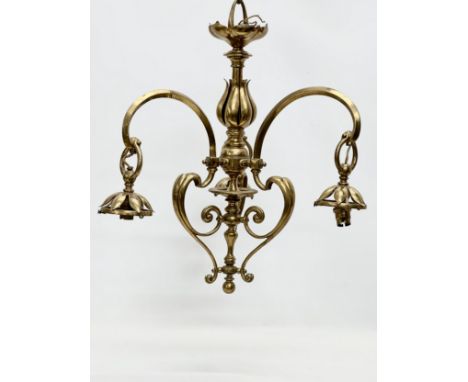 A good quality Early 20th Century Art Nouveau brass chandelier, in the manner of W.A.S Benson. 48x57cm