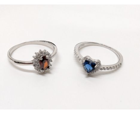 2 silver rings, sizes P &amp; Q