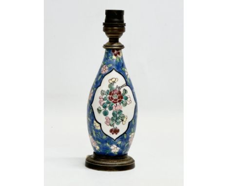 An Early 20th Century painted enamel porcelain table lamp. 21cm