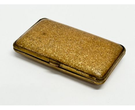 An Early 20th Century glitter Bakelite cigarette case. 8cm