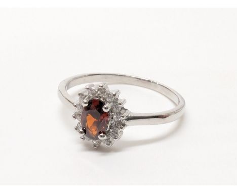 A silver garnet CZ ring, UK size P