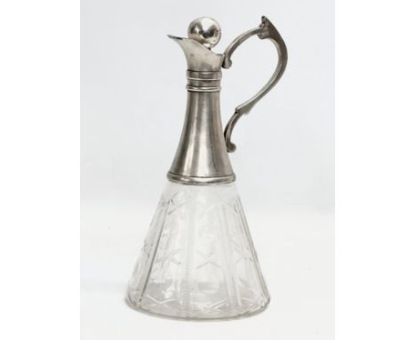 A Mid 20th Century lens and notch cut claret jug. 28cm