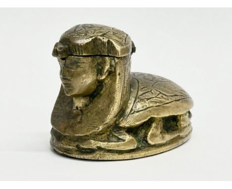 A Late 19th Century Victorian brass sphinx inkwell. 7x5cm