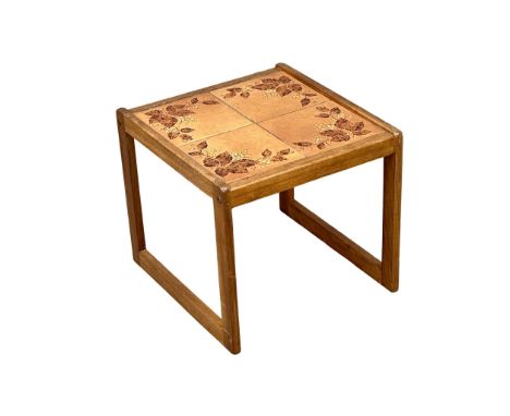 A Mid Century teak lamp table with tile top. 44.5x58x41cm. 2