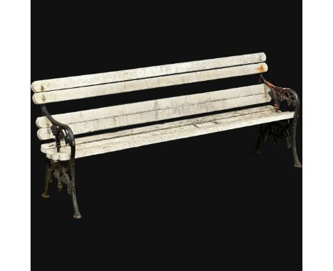 A Late 19th Century Victorian garden bench with cast iron ends and wooden straps. 198cm (5)