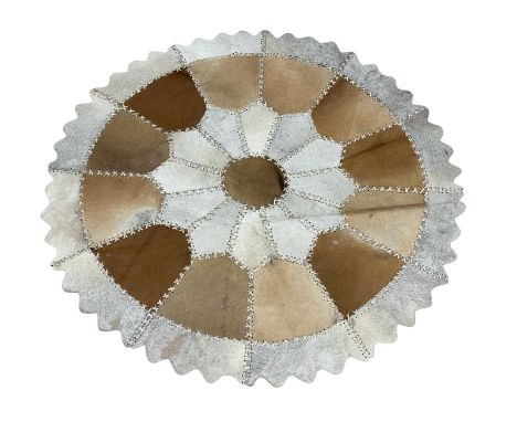 A vintage cow hide and leather rug. 123cm