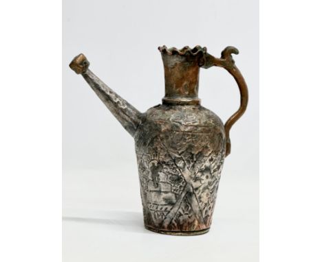 A 19th Century Persian hammered copper water ewer. 27x27cm