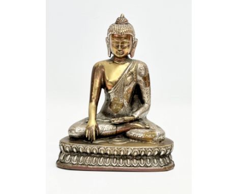 An Early 20th Century engraved plated brass Shakyamuni Buddha statue. 16x9.5x20cm