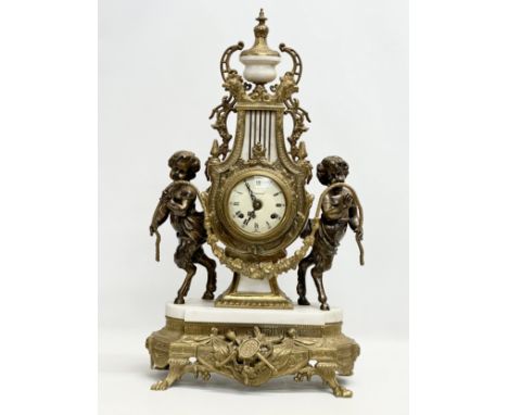 Franz Hermle. A large 18th Century style brass and marble mantle clock, with bronzed cherubs. Imperial. 35x22x62cm