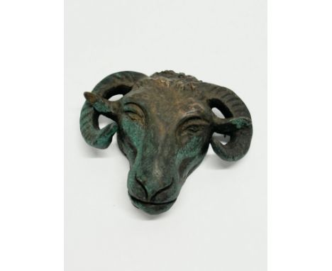 A 19th Century bronze rams head mount. 10x10cm