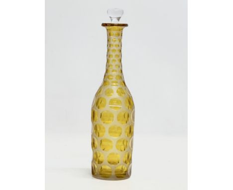 A large 19th Century Victorian stained yellow lens cut decanter. 34cm