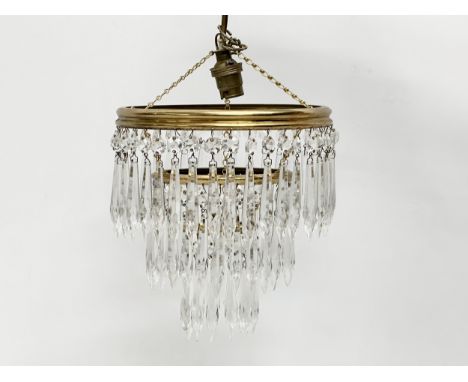 A Mid 20th Century light fitting with crystal droplets. 21x32cm
