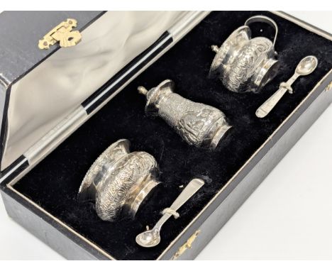 An Indian silver condiment set in case, stamped sterling. 97.5g without liners.