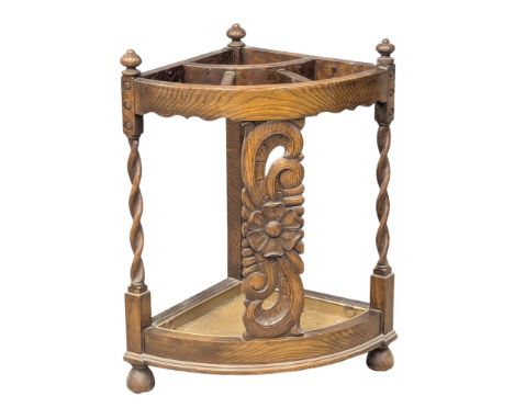 An Early 20th Century oak corner stick stand. 57x41x73cm