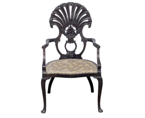 An Edwardian mahogany fan back armchair.