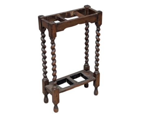 An Early 20th Century oak umbrella stick stand with twist supports. 38x16x65cm