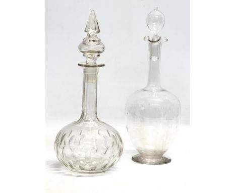 A Late 19th Century Victorian lens cut decanter and an Edwardian ovoid form glass decanter. 30cm