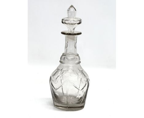 A 19th Century Early Victorian glass shaped decanter. Circa 1840. 28cm