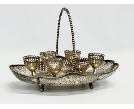 A Late 19th Century Victorian silver plated egg cups on stand. 29x21cm