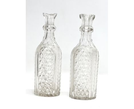 A pair of Late 19th Century Victorian cut glass carafe decanters. 25cm
