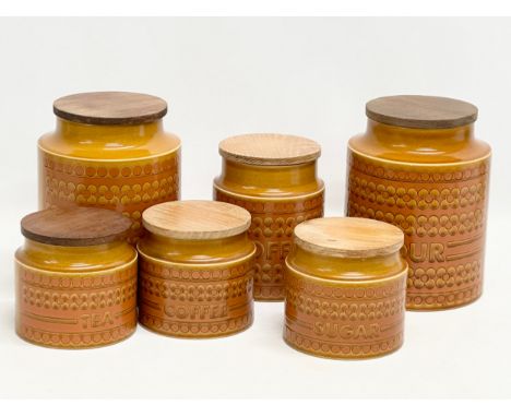 A set of Mid Century Hornsea “Saffron” pottery kitchen preserve jars with teak lids.